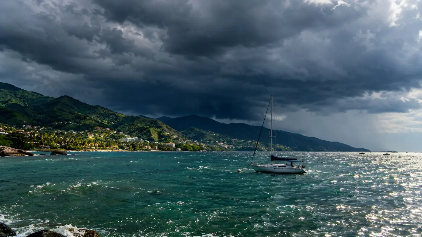 Dark summer storm clouds building over Banderas Bay in the late afternoon